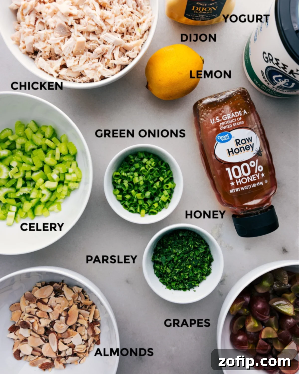 All the fresh ingredients for a healthy chicken salad recipe, meticulously prepped and laid out for easy assembly.