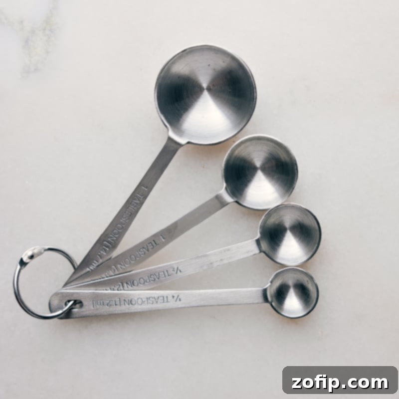 A selection of colorful measuring spoons arranged neatly, indicating readiness for precise small-scale ingredient measurements