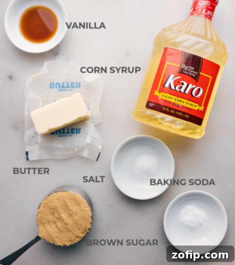 Ingredients for Microwave Caramel Corn laid out on a table, including popcorn, butter, brown sugar, corn syrup, salt, baking soda, and vanilla extract.