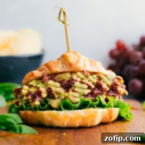Close-up of a serving of Pesto Chicken Salad, showcasing its vibrant ingredients and creamy texture, ready to be enjoyed.