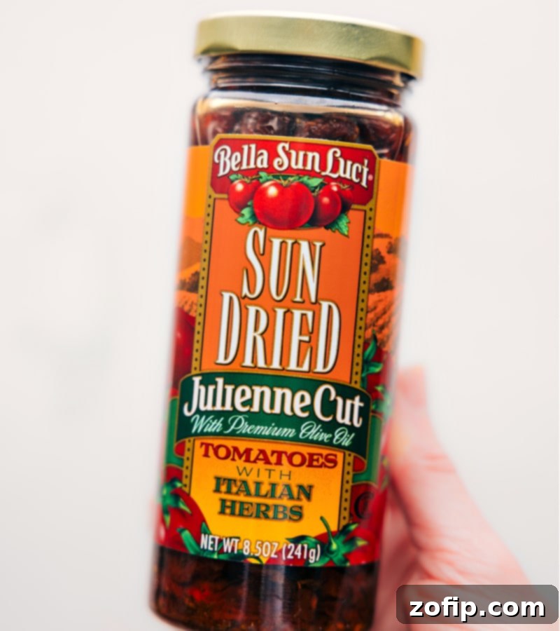 Marry Me Chicken is so irresistibly delicious, it might just elicit a marriage proposal! Recipe via ChelseasMessyApron.com #marryme #chicken #creamy #sauce #basil #elegant Close-up of the flavorful sun-dried tomatoes used in the Marry Me Chicken recipe, highlighting their rich color and texture.