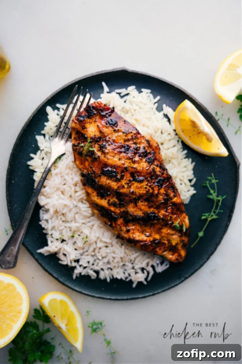 The BEST Chicken Rub for Mouthwatering Grilled Chicken Flavorful grilled chicken seasoned with the best chicken rub, served on a bed of rice.