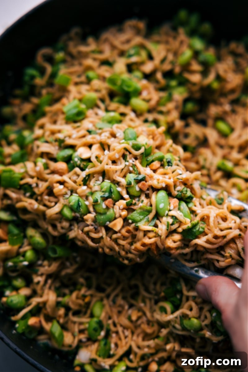 Delicious Peanut Butter Ramen, perfectly garnished and ready to be enjoyed. An inviting overhead shot of the finished Peanut Butter Ramen, beautifully arranged and ready for serving, garnished with fresh herbs and peanuts.