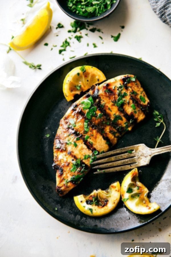 Perfectly Flavored and Cooked Grilled Chicken The finished meat, perfectly flavored and cooked, served on a plate and ready to be enjoyed.