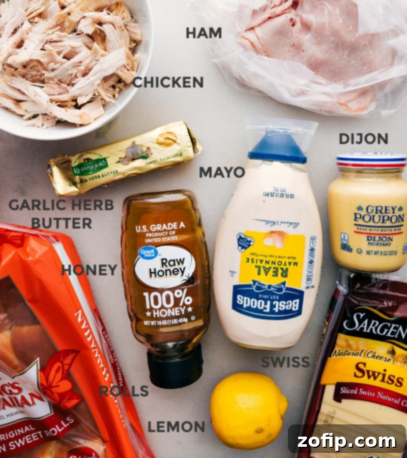 These Chicken Cordon Bleu Sliders pack a serious flavor punch! Recipe via chelseasmessyapron #dinner #quick #easy #simple #familyfriendly #kidfriendly #onepan #appetizer #chickencordonbleu #sliders Ingredient shot-- image of all the ingredients used in this dish laid out on a wooden surface.