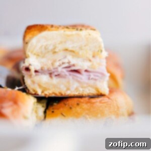 Bite-Sized Chicken Cordon Bleu Bliss 2 Close-up image of a single Chicken Cordon Bleu Slider, showing the melted cheese and golden bun.