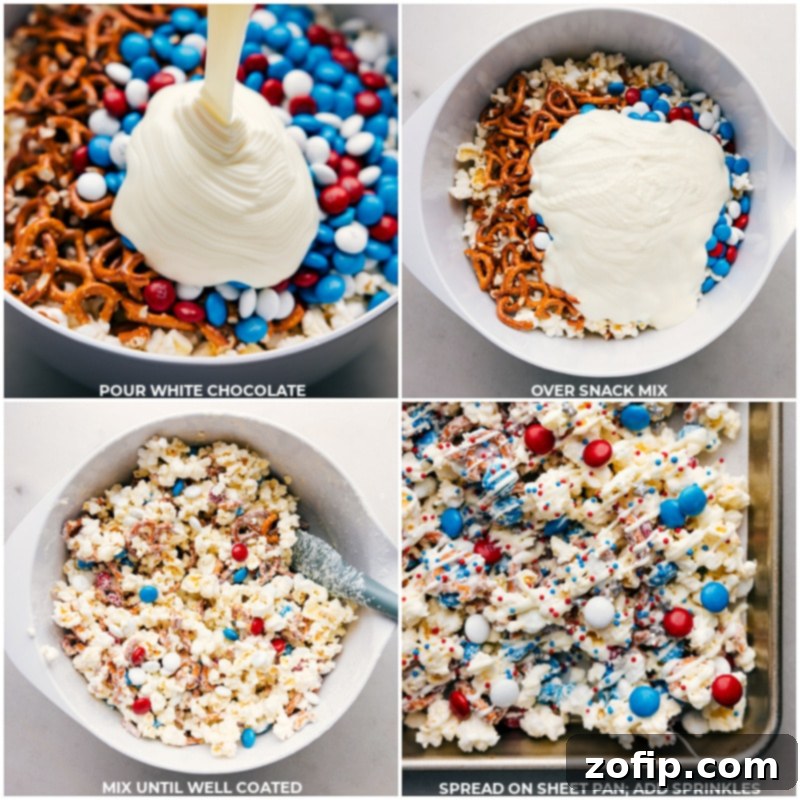 Melted white chocolate being drizzled over a large bowl of popcorn, pretzels, and M&M's, all ready to be mixed into a delicious 4th of July Popcorn snack.