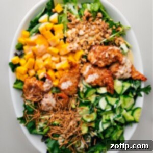 Island Coconut Shrimp Greens 2 A beautifully plated Coconut Shrimp Salad with vibrant colors, crispy shrimp, mango, and greens.
