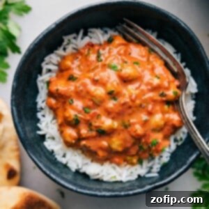 A bowl of creamy Butter Chickpeas garnished with fresh herbs, ready to be served