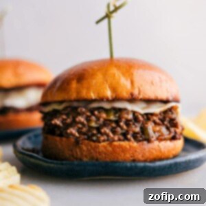 Close-up of a delectable Philly Cheesesteak Sloppy Joe on a brioche bun with melted provolone.