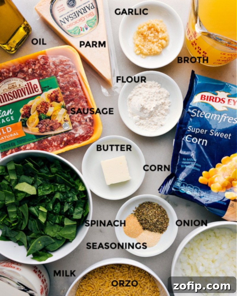 A flat lay image showcasing all fresh and pantry ingredients laid out for making the Sausage, Corn, and Spinach Orzo recipe.