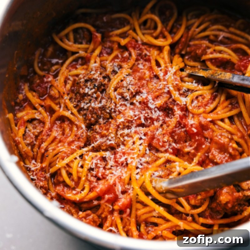 Up-close overhead image of Instant Pot Spaghetti in the pot, ready to be served and enjoyed