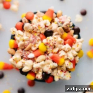 A bowl of finished Candy Corn Popcorn, ready to be served and enjoyed.