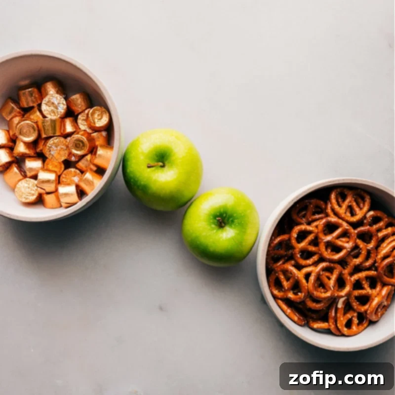 The 3-ingredients in this recipe set out for easy assembly: green apples, Rolos, and pretzels.
