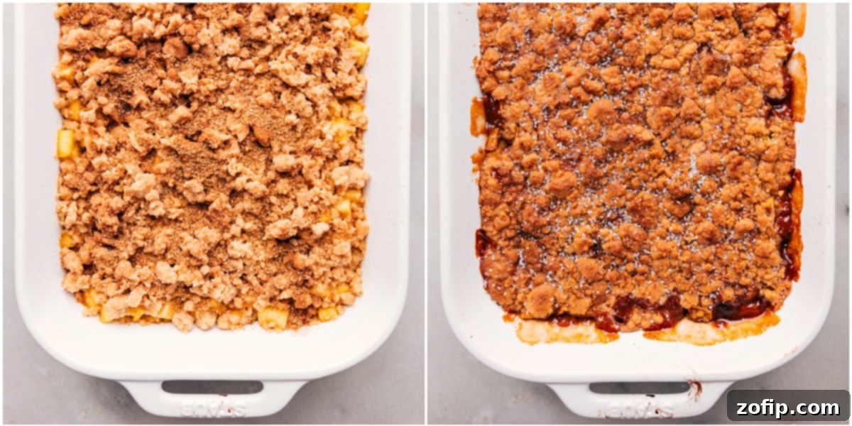 A baking dish of apple cobbler with a golden-brown, crunchy topping being removed from the oven, steam gently rising.