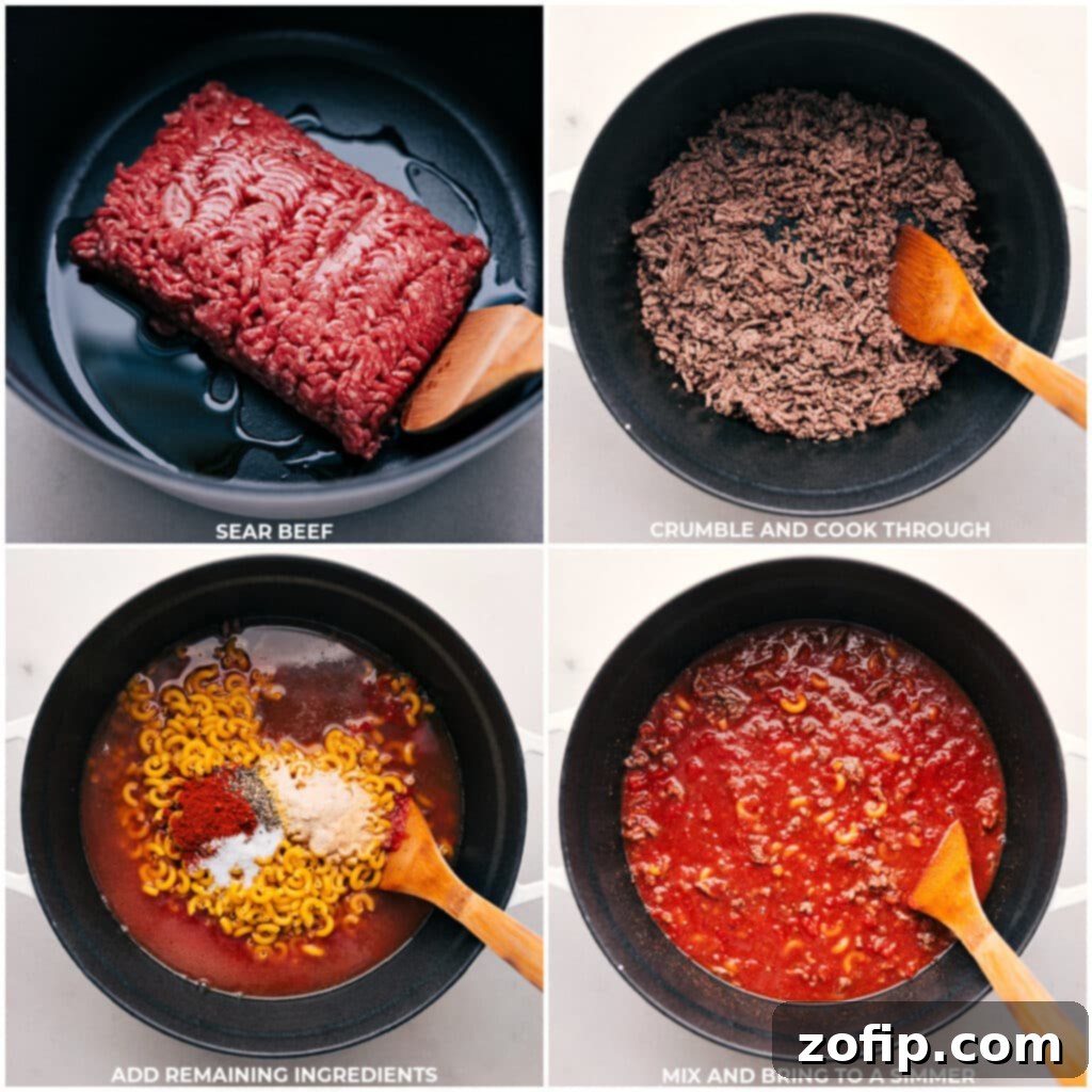 Close-up of ground beef browning in a large pot, with ingredients being added.