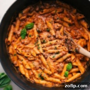 Penne Pasta with Italian Sausage in the Pot. A close-up view of the finished creamy penne pasta with Italian sausage, ready to be served from the pot.