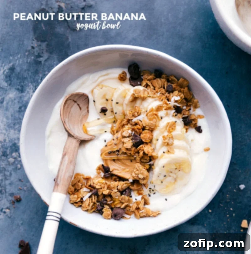A creamy and satisfying Peanut Butter Banana Yogurt Bowl, topped with thinly sliced bananas and a generous drizzle of peanut butter, making it an ideal healthy breakfast or energizing snack.