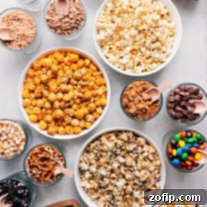 A colorful Popcorn Bar with various toppings and choices, prepared for a celebration.