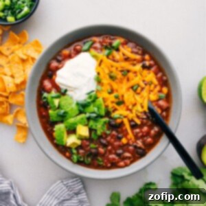 A bowl of Taco Soup with various toppings adds a burst of flavor and texture to this delicious dish.