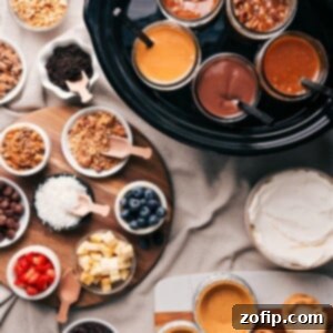 Sweet Treat Pie Bar Ideas 2 Various dessert toppings and fillings including glass jars filled with caramel, chocolate, and other sauces, accompanied by bowls of crushed nuts, blueberries, coconut shreds, chocolate chips, and other delectable ingredients for a dessert pie bar.