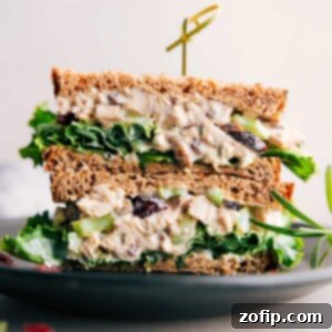 Aromatic Rosemary Chicken Salad 2 Scrumptious rosemary chicken salad sandwich, halved to reveal its generous, flavorful filling.