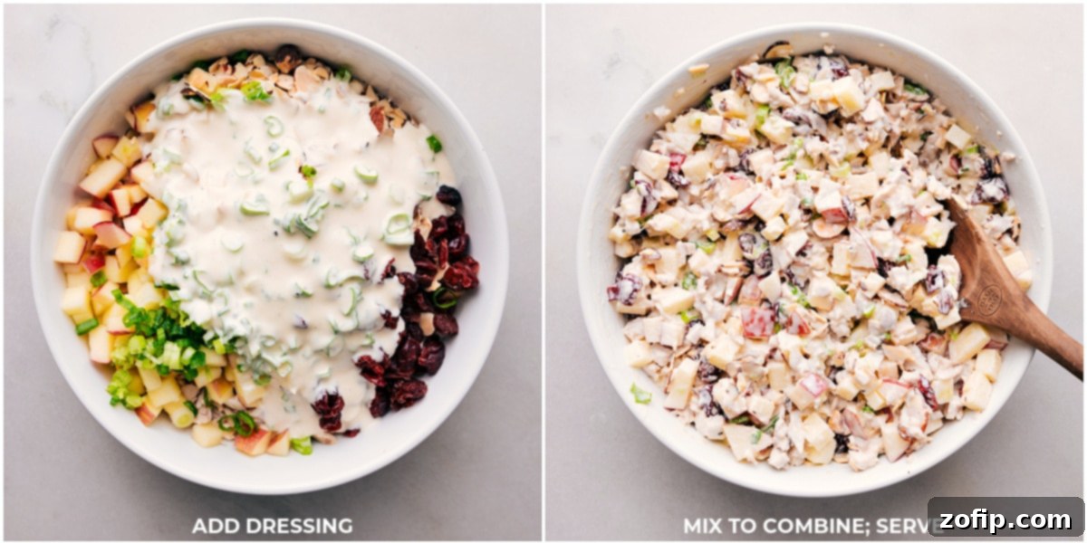 Creamy dressing being poured over a bowl of mixed chicken and apple ingredients, ready to be gently folded together.