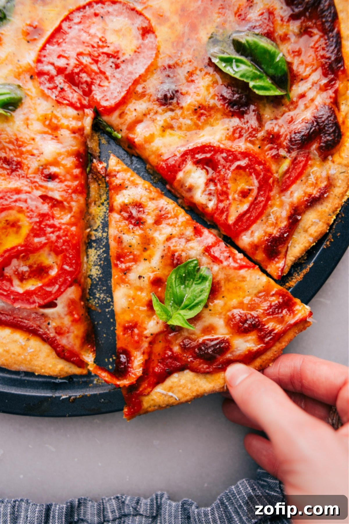Slice of heaven: Freshly baked No-Yeast Pizza straight from the oven A freshly baked No-Yeast Pizza with a perfect slice being lifted out, showcasing the crispy crust and melted toppings.