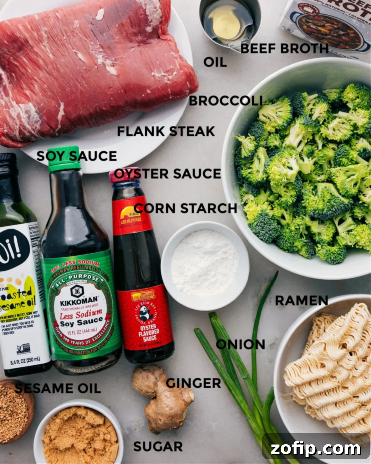 All the fresh ingredients for Beef and Broccoli Ramen, neatly prepped and arranged, including flank steak, broccoli, cornstarch, various sauces, and ramen noodles, ready for cooking.