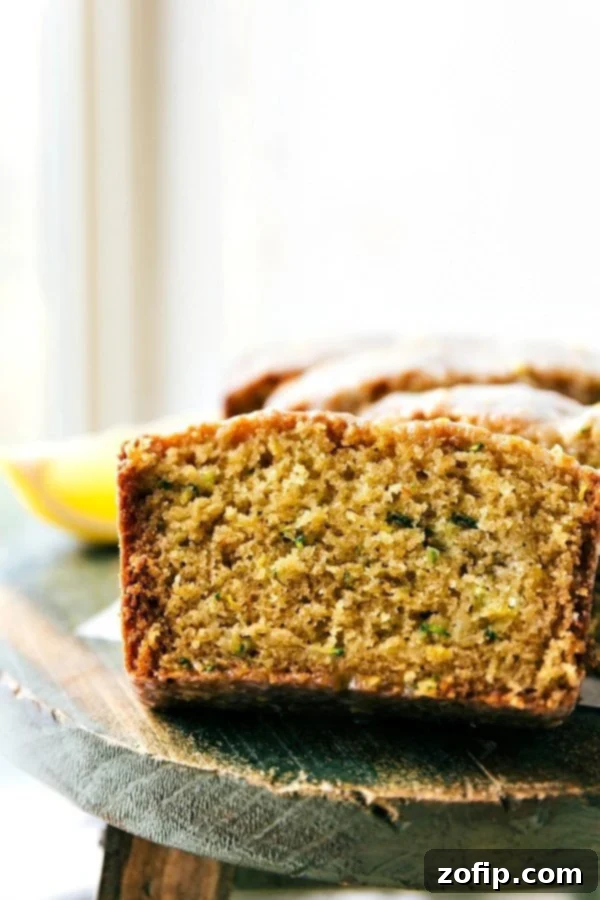 The delicious and flavorful lemon zucchini bread cut into slices, showcasing its moist texture.