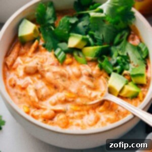 A big bowl of Buffalo Chicken Chili with a spoon in it.