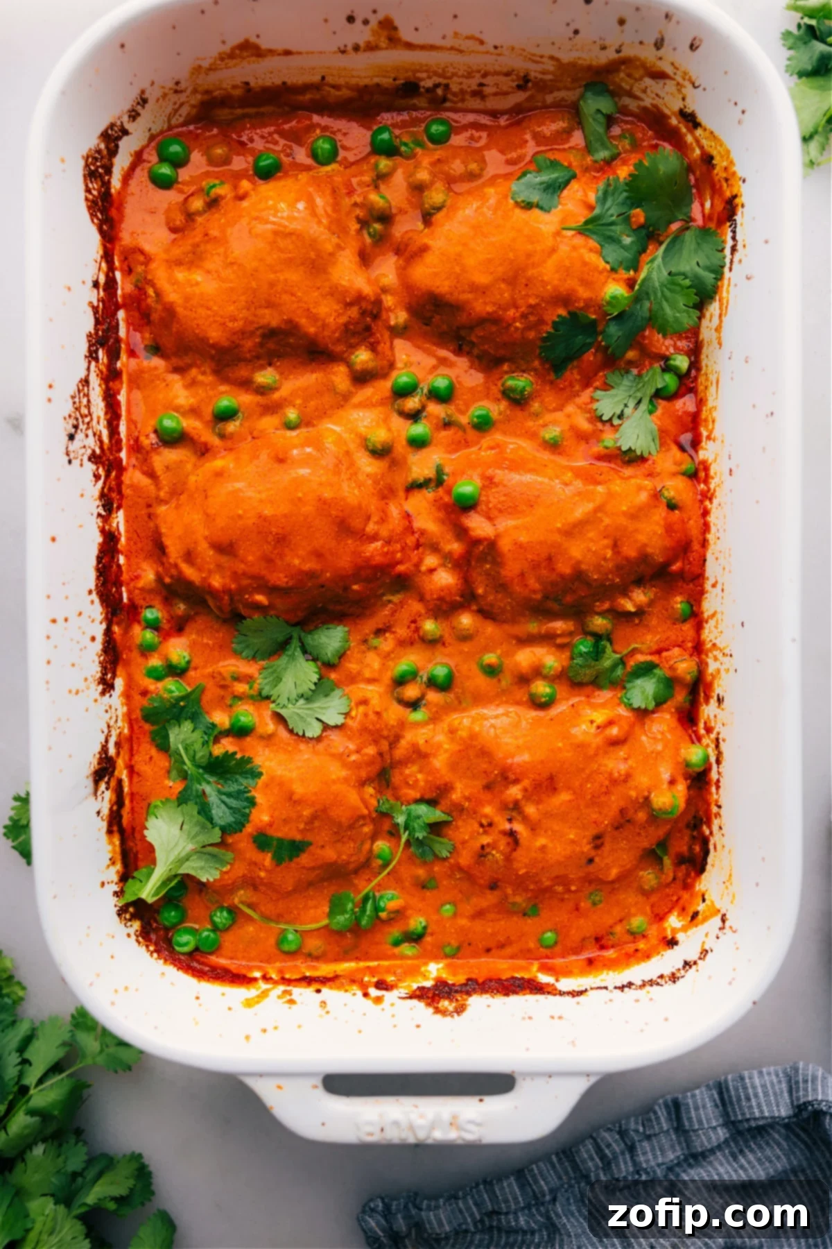Hot and Delicious One-Pan Tikka Masala, Just Out of the Oven One-pan Tikka Masala freshly out of the oven, warm and covered in delicious sauce, ready to be served.