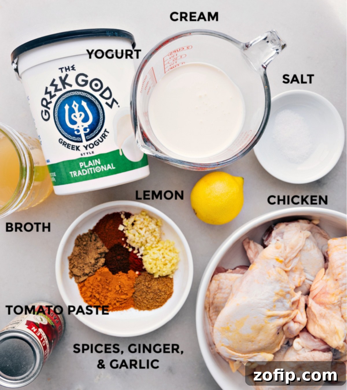 Recipe Ingredients: Chicken, Spices, Yogurt, Cream, and More for a Perfect Tikka Masala A vibrant array of fresh ingredients laid out for the Chicken Tikka Masala recipe, including chicken, various spices, creamy yogurt, heavy cream, and more.
