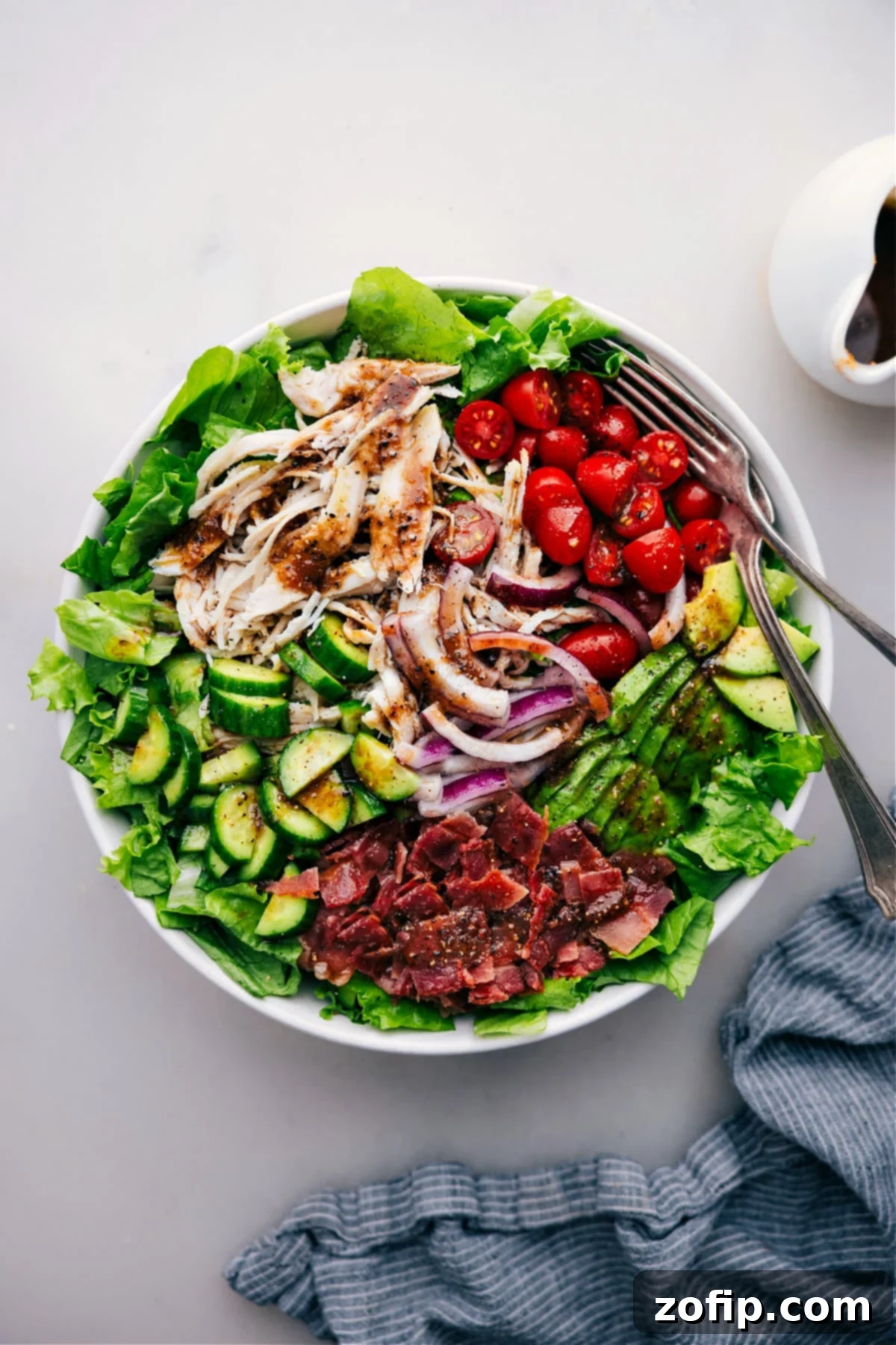A beautifully dressed Turkey Bacon Avocado Salad, vibrant with fresh greens, tender turkey, crispy bacon, and creamy avocado, ready to be enjoyed.