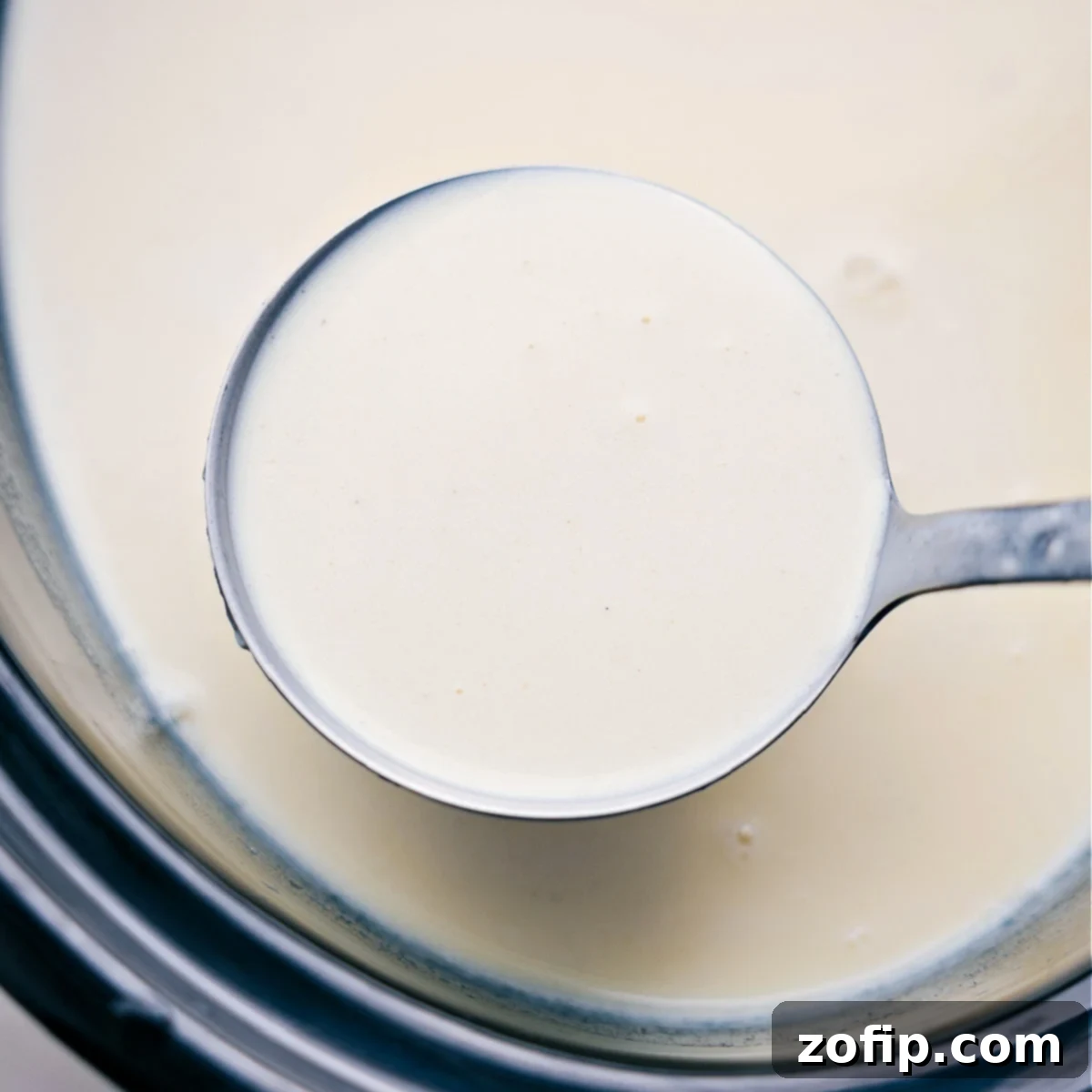 A ladle full of the warm and freshly prepared beverage, ready to be served and enjoyed.