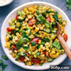 Summer Corn Salad 3 Fresh corn salad in a bowl with a serving spoon.