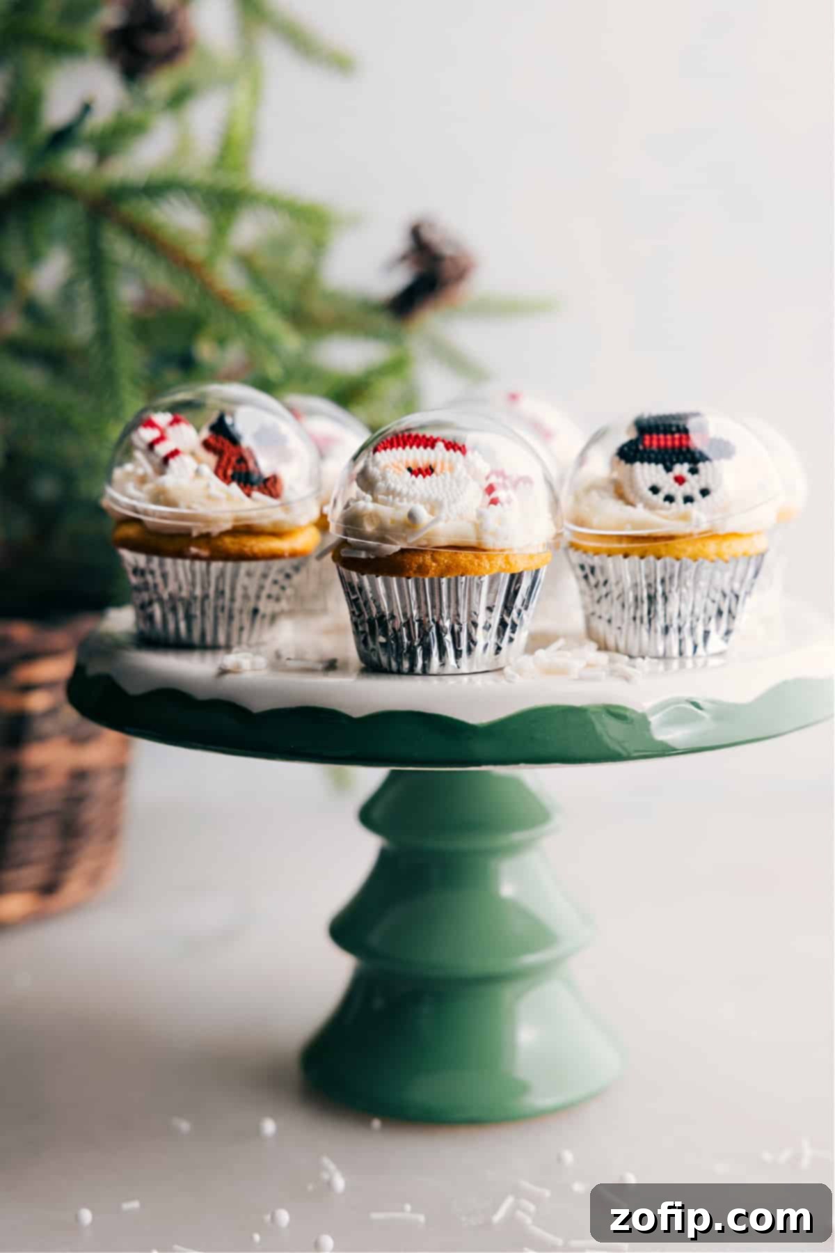Ornament-Styled Festive Christmas Cupcakes on Display Stand A stunning display of meticulously decorated Christmas cupcakes on a multi-tiered stand, each resembling a miniature ornament with festive toppings, creating a beautiful and inviting dessert presentation.