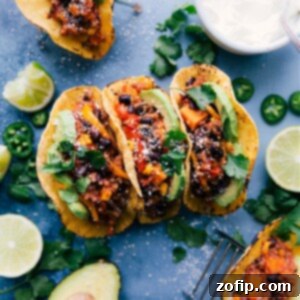 A vibrant close-up of Quinoa Fajitas, showcasing the rich, slow-cooked filling with chicken, quinoa, and colorful vegetables, garnished with fresh cilantro, ready to be served.