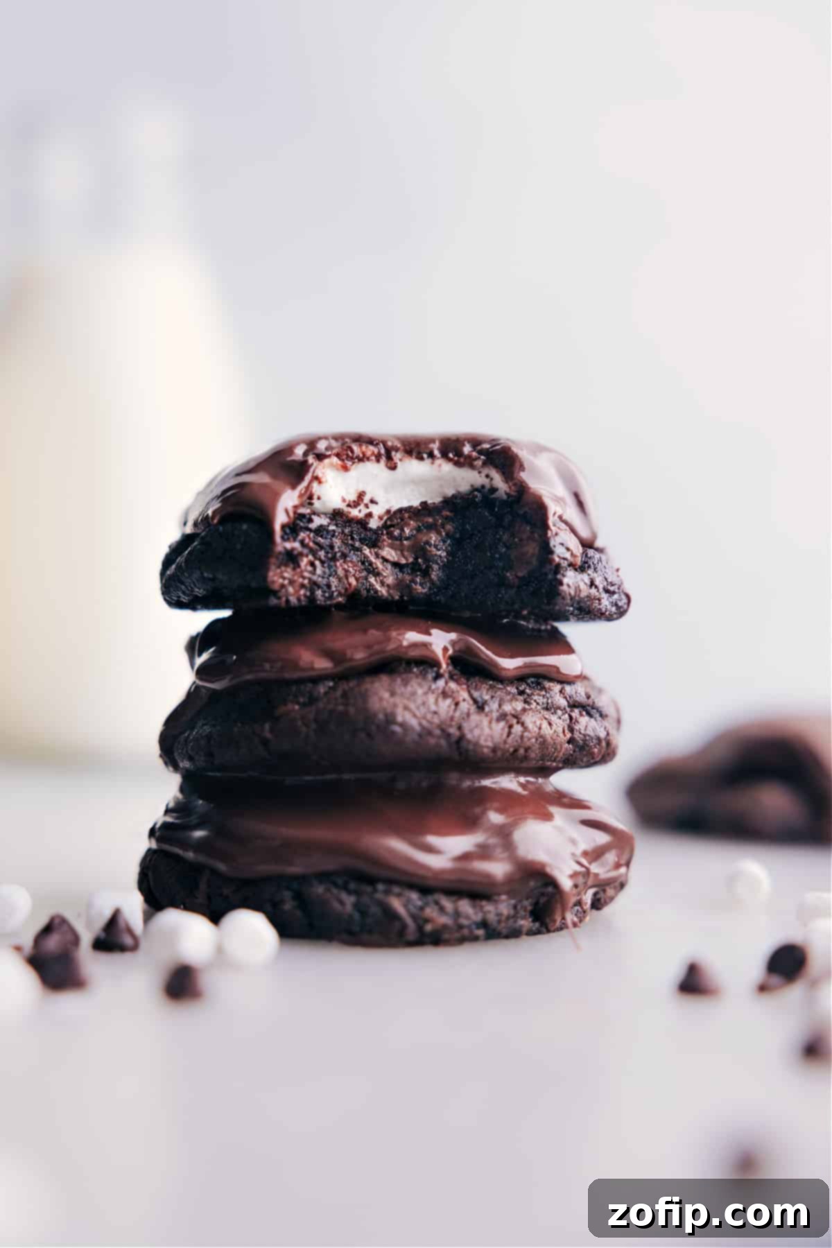Stack of rich, fudgy Chocolate Marshmallow Cookies with gooey marshmallows and smooth chocolate topping.