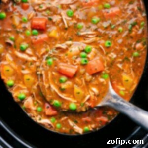 Effortless Homestyle Chicken Stew 2 Crockpot Chicken Stew in the crockpot with a big label full coming out.