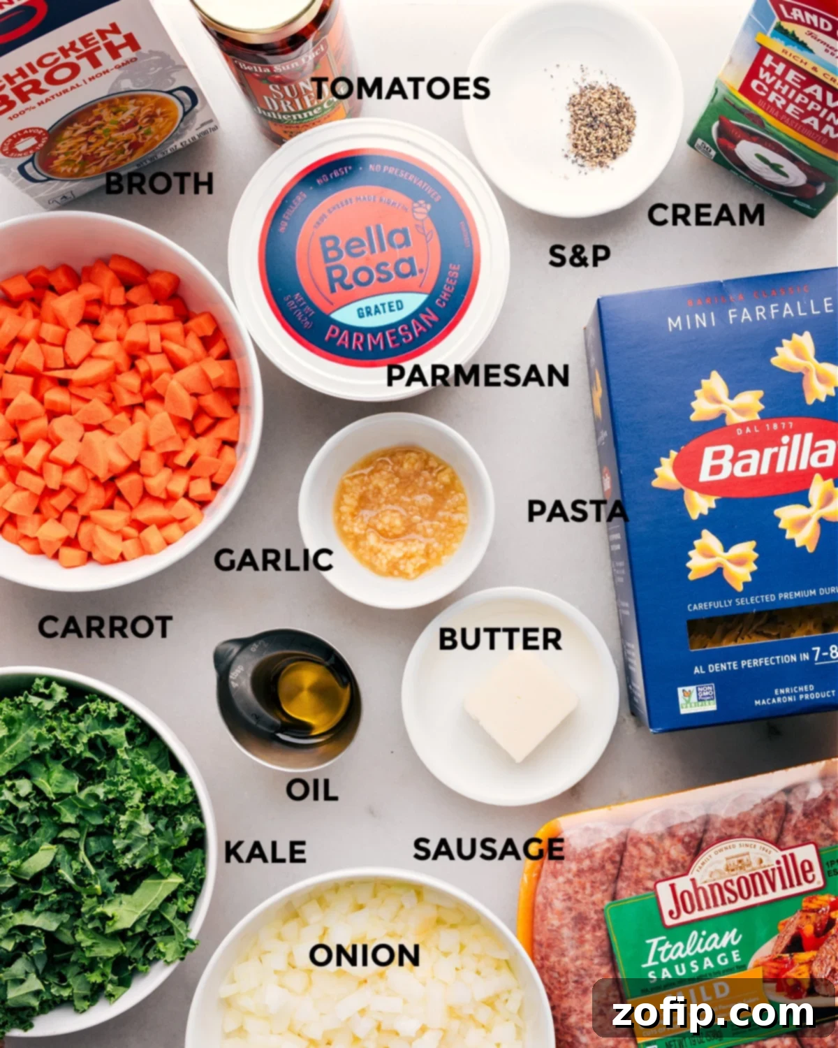 Gathering all the essential ingredients for Italian Sausage Pasta Soup: creamy broth, savory sausage, pasta, fresh vegetables, Parmesan, and sun-dried tomatoes.