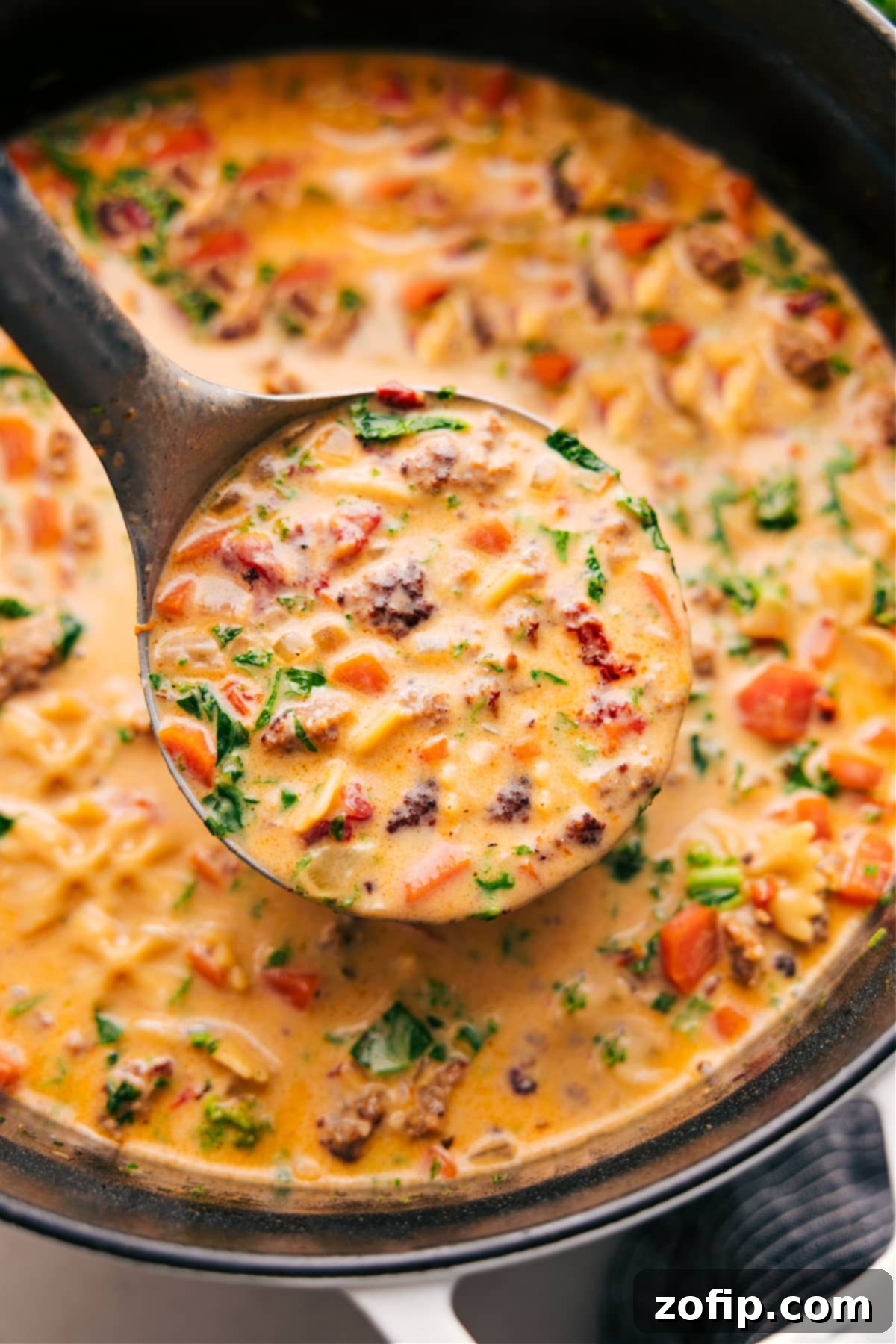 A beautifully composed flat lay of a bowl of Creamy Italian Sausage Pasta Soup, ready to be enjoyed.