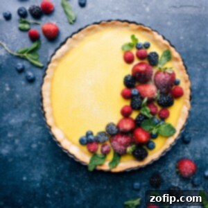 Zesty Lemon Delight 2 A slice of the beautiful Lemon Tart, showing the creamy filling and golden crust, ready to be served.