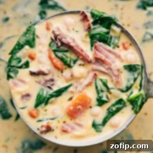 A bowl of creamy Ham and Bean Soup, garnished and ready to serve.