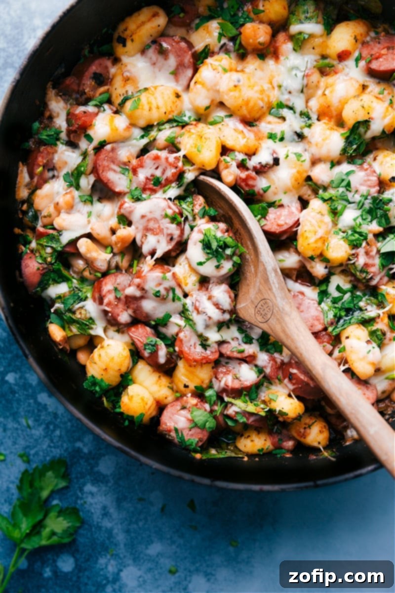 Beautifully plated White Bean Gnocchi, a hearty and flavorful one-skillet dish perfect for any occasion. #dinnerrecipe #comfortfood #mediterraneanfood A stunning final shot of the White Bean Gnocchi, served in a bowl, showcasing the rich sauce, tender gnocchi, and fresh spinach, ready to be enjoyed.