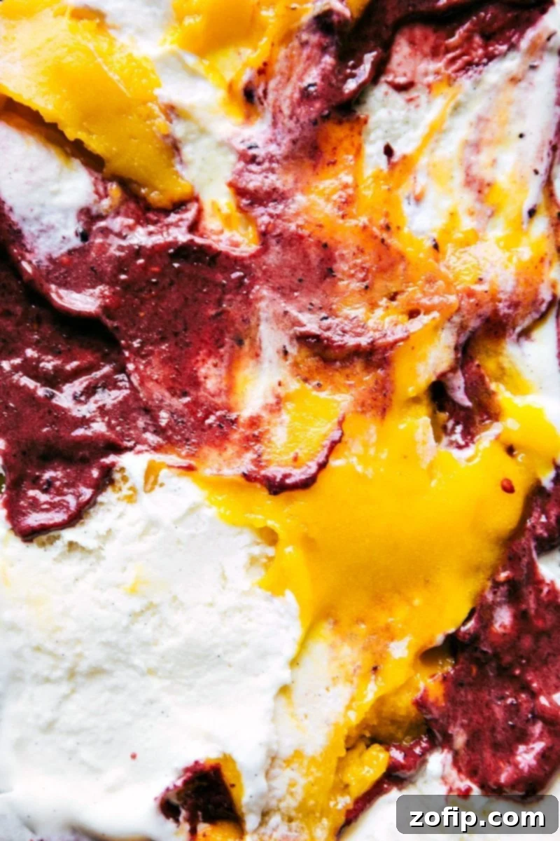 The assembled Sorbet Terrine layers inside a loaf pan, ready to be covered and frozen. It showcases the distinct, colorful layers of fruit puree, sorbet, and vanilla ice cream before setting.