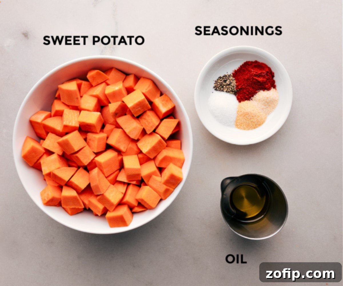 Ingredients for Air Fryer Sweet Potatoes prepped out for easy assembly on a wooden board.