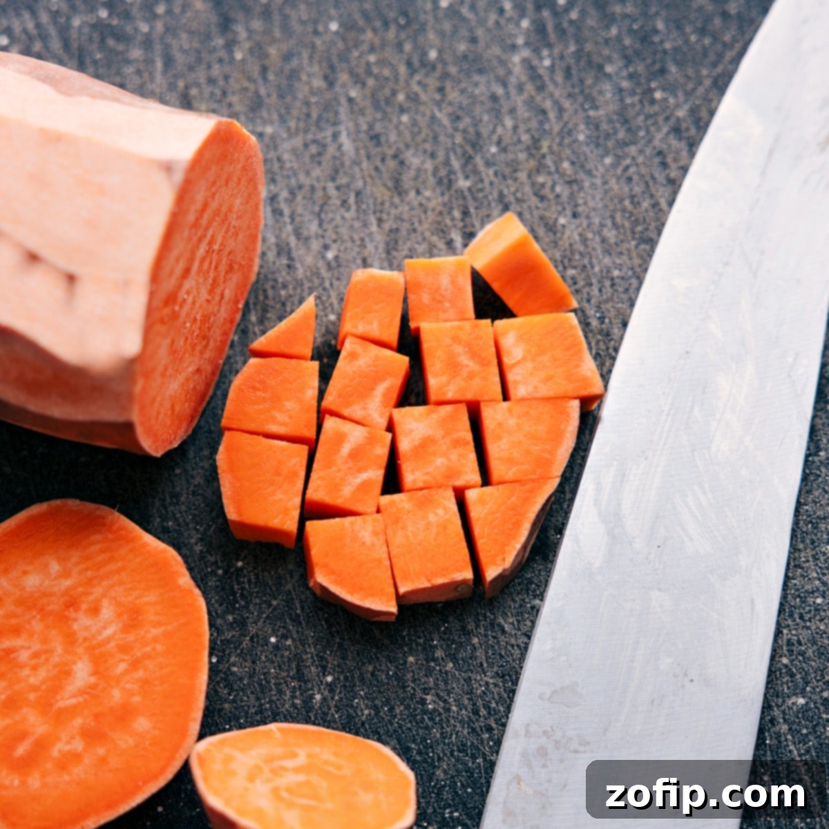 Image of sweet potatoes perfectly chopped into uniform cubes for these Air Fryer Sweet Potatoes.