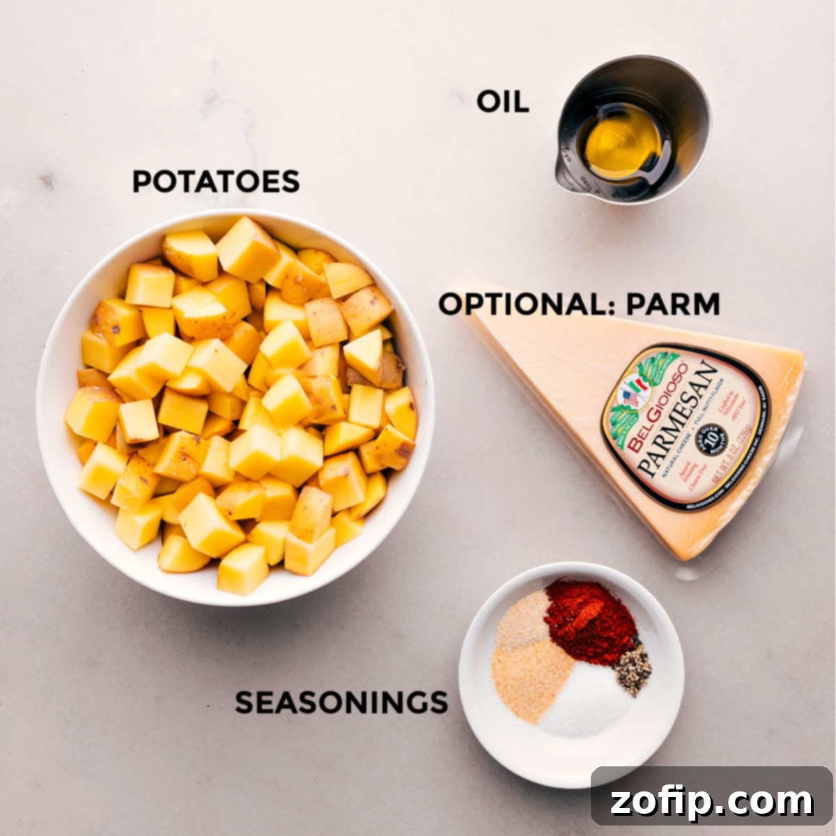 Essential Ingredients for Air Fryer Breakfast Potatoes An array of fresh ingredients for Air Fryer Breakfast Potatoes, including gold potatoes, olive oil, and various spices.