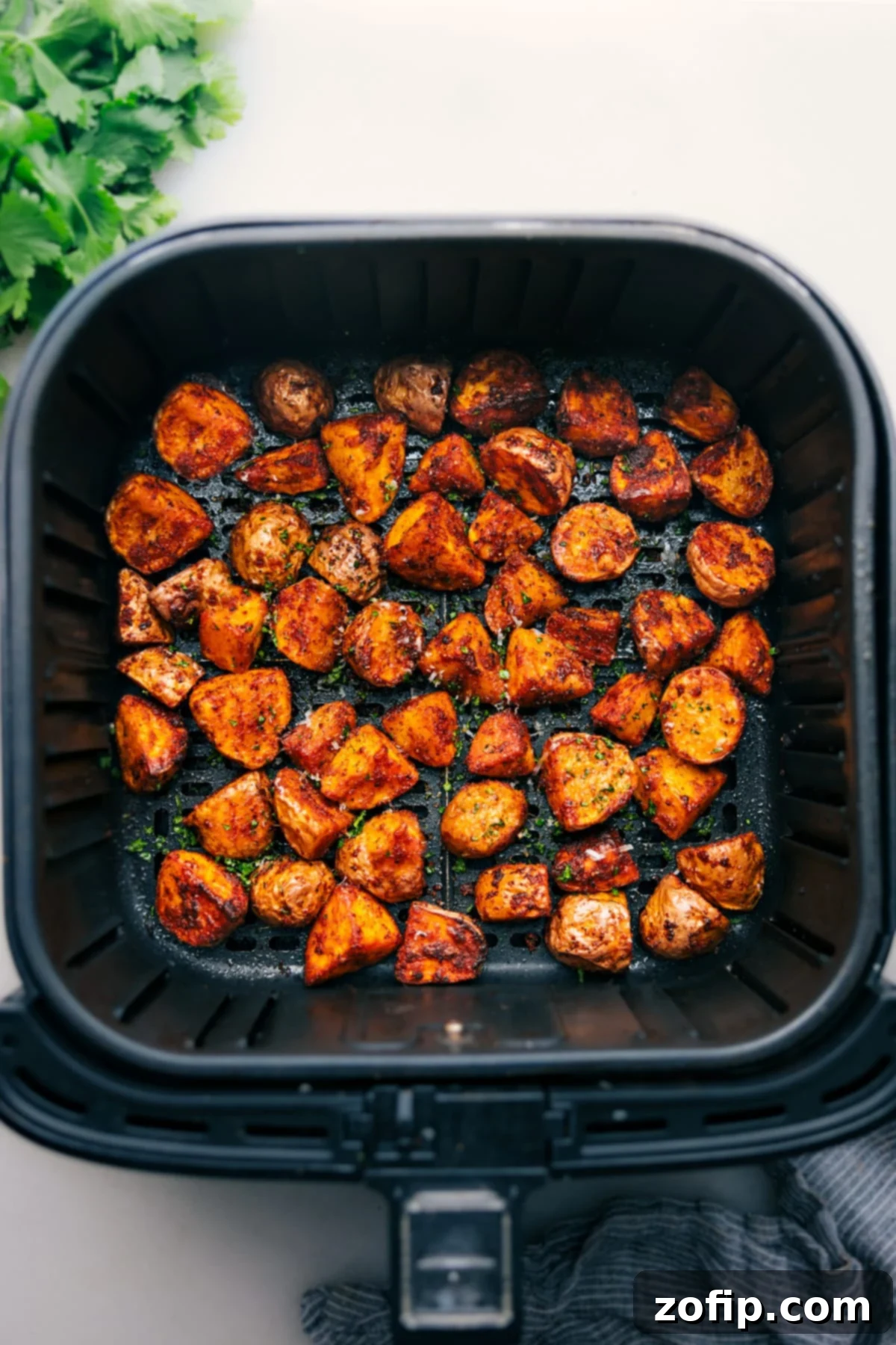 Perfectly Crispy Air Fryer Potatoes Freshly cooked, golden-brown Air Fryer Potatoes served in a bowl, ready to enjoy.